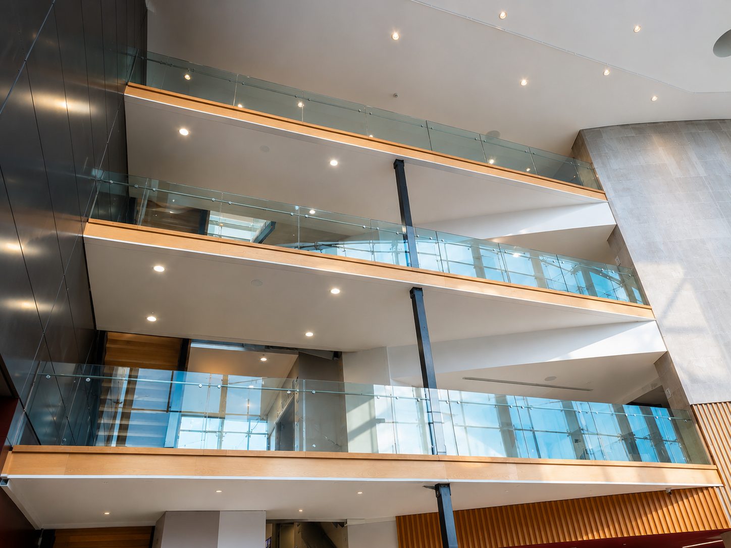 Glass balustrades along walkways in a multi-storey atrium