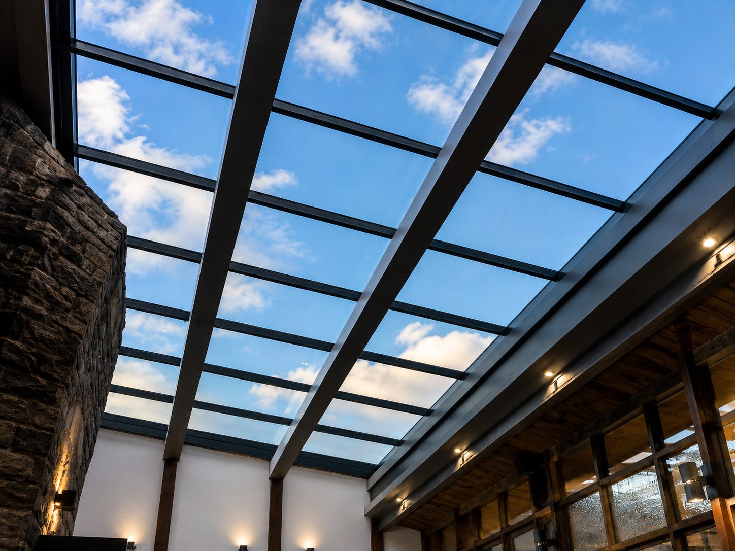 Interior view of a large ridge rooflight with exposed beams