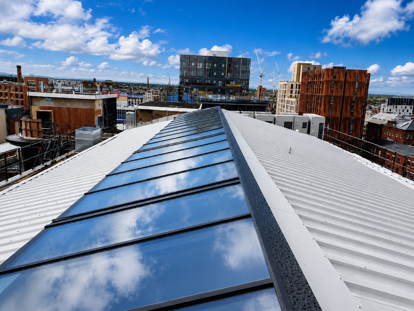 Ridge rooflight along a standing-seam metal roof on a commercial building