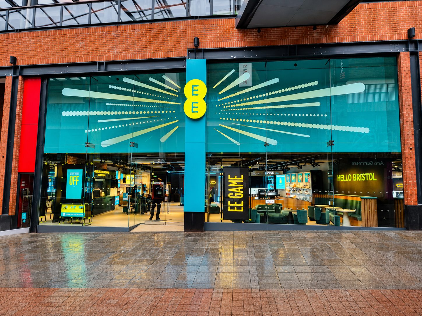 Frameless structural glass shopfront on an EE store