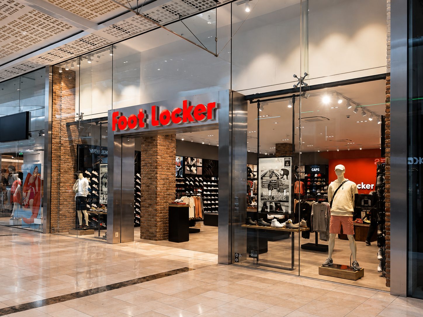 Frameless structural glass shopfront with stainless steel entrance frame