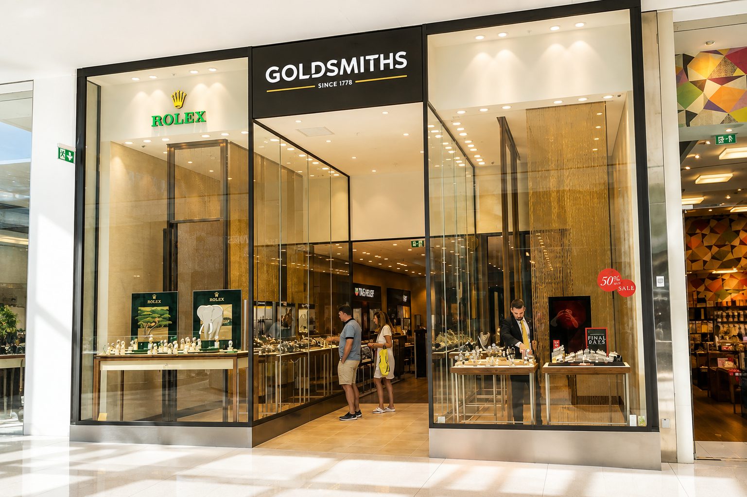 Large format frameless glass shopfront to a jewellers in a shopping centre