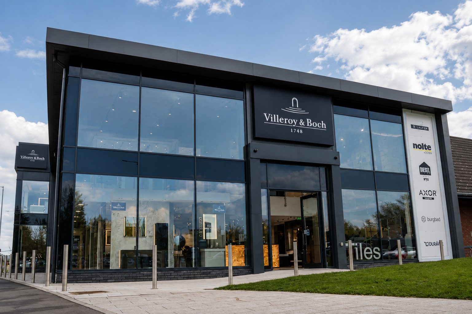 Full-height aluminium-framed curtain walling on a commercial showroom