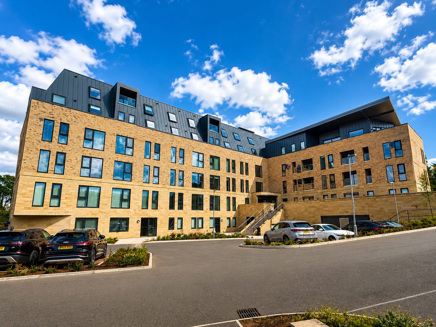 Aluminium windows across a new-build brick apartment block