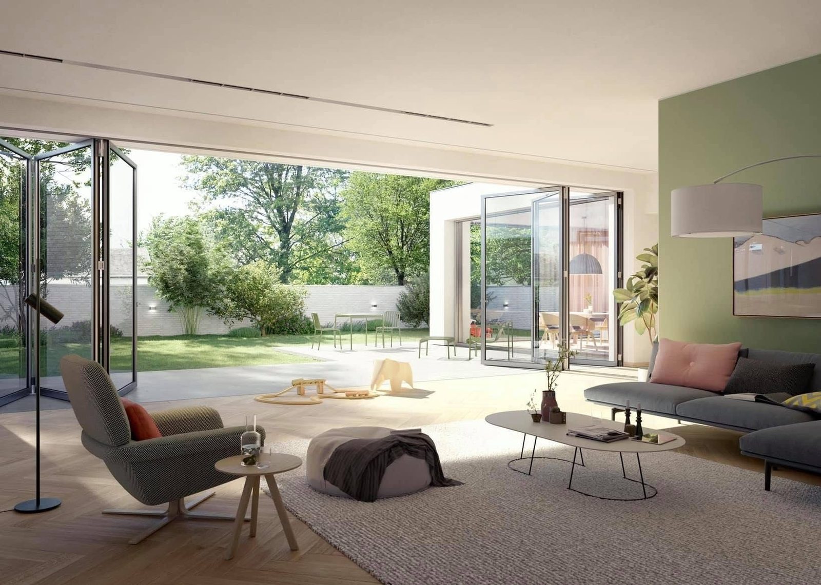 Aluminium bifolding doors opened from an open-plan living room onto a garden