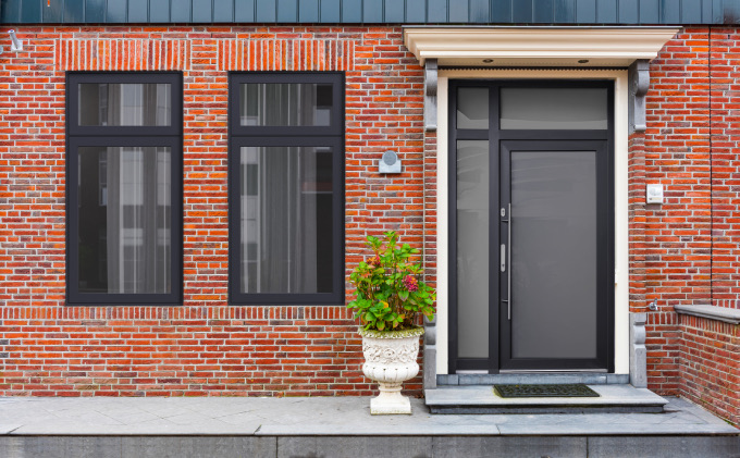 Exlabesa aluminium windows and entrance door on a brick townhouse